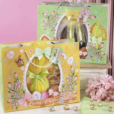 Caixas decorativas de chocolate com tema pascal, laços verdes e rosas, flores e figuras de coelho