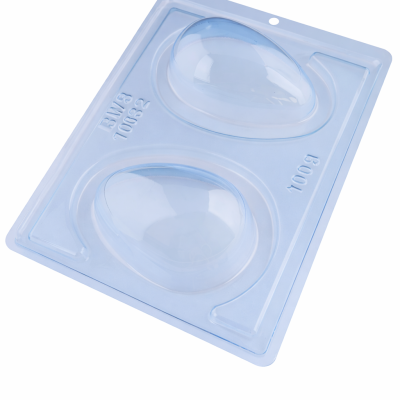 Molde transparente de plástico com duas cavidades em forma de ovo com texto BW3 70032 e 100g