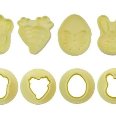 Cortadores de bolachas amarelos com formas de pata, cenoura, ovo e coelho
