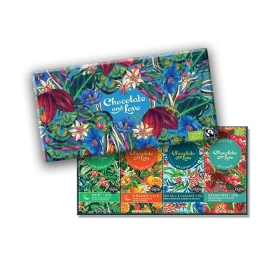 Caixa decorativa com quatro barras de chocolate de sabores variados e embalagens florais coloridas