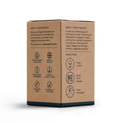 Caixa de cartão castanho com texto preto sobre pastilhas efervescentes para dentes