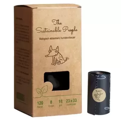 Caixa de papel reciclado com texto e ilustração de cão, e rolo preto de sacos para cães.