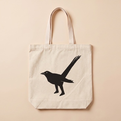 Beige canvas tote bag with black bird silhouette print