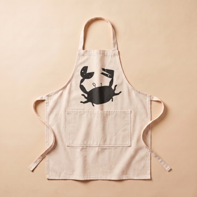 Beige cotton apron with black crab print and front pocket