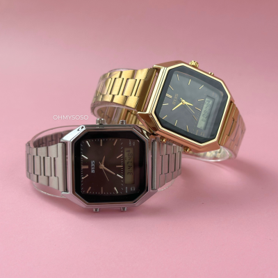 Dois relógios de pulso metálicos, dourado e prateado, com mostradores quadrados pretos
