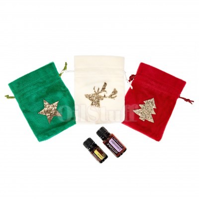 Três sacos de veludo natalícios com motivos em glitter dourado e dois pequenos frascos de vidro.