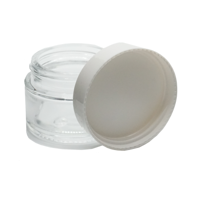 Frasco pequeno de vidro transparente com tampa branca aberta