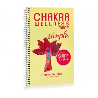 Caderno amarelo espiral com texto Chakra Wellness super simples