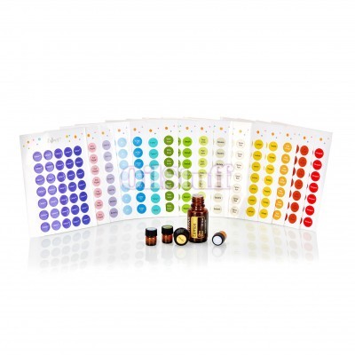 Folhas com autocolantes coloridos e frascos pequenos de vidro âmbar com tampas pretas