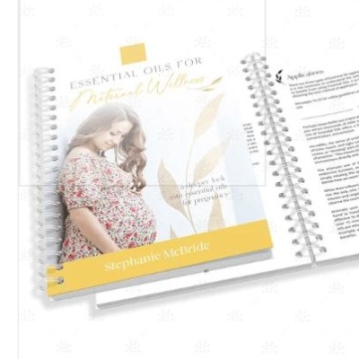 Livro de capa dura com foto de mulher grávida e texto ESSENTIAL OILS FOR Natural Wellness