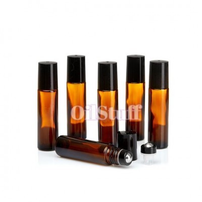 Frascos de vidro âmbar com tampas pretas e aplicadores de esfera