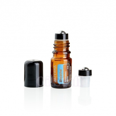 Frasco de óleo essencial dōTERRA Breathe aberto com tampa e redutor ao lado