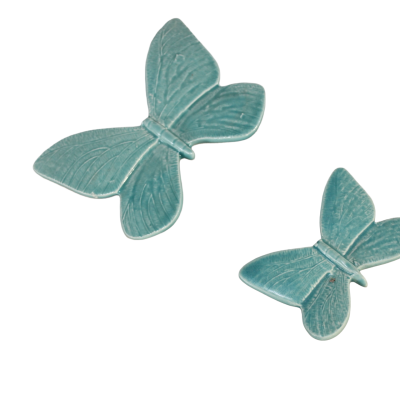 Borboletas decorativas de cerâmica azul turquesa