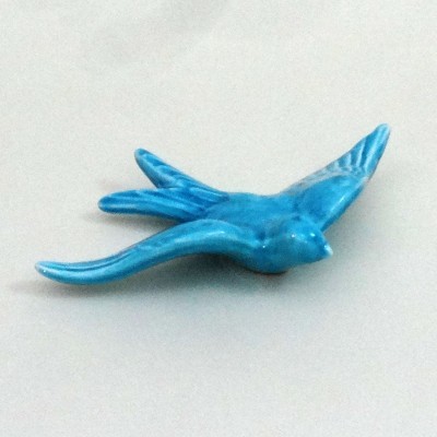 Pássaro decorativo azul turquesa em cerâmica com acabamento lustroso