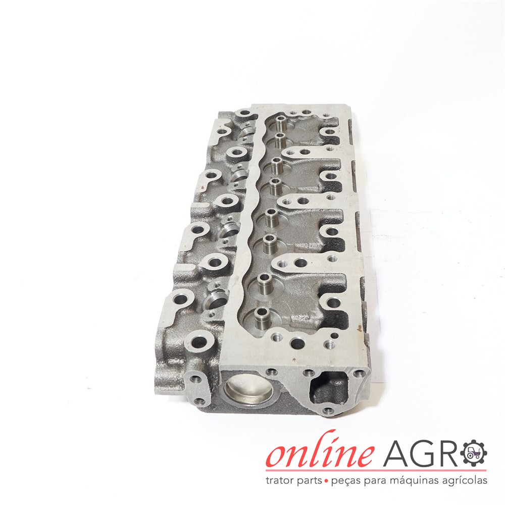 Cabeça de motor, Yanmar, OAS95083PT Peça de motor metálica sobre fundo branco com logótipo online AGRO visível
