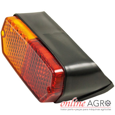 Luz traseira preta de plástico com visor vermelho e laranja para máquinas agrícolas.