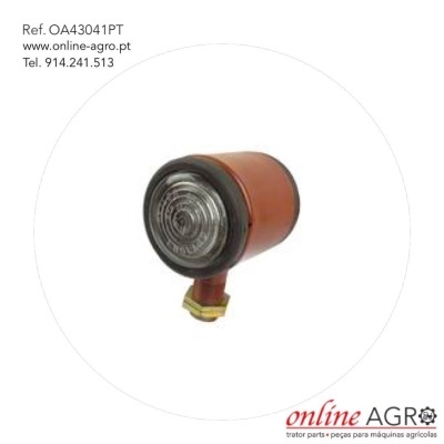 Luz redonda para máquina agrícola com corpo castanho e lente transparente