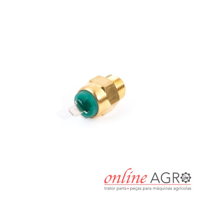 Interruptor metálico dourado com parte verde e terminal de metal