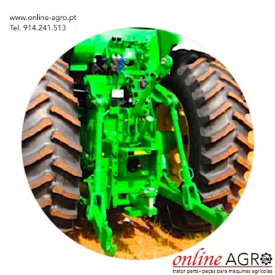 Traseira de trator verde com pneus grandes e sulcados em solo de terra, texto www.online-agro.pt Tel. 914.241.513 e logo online AGRO.