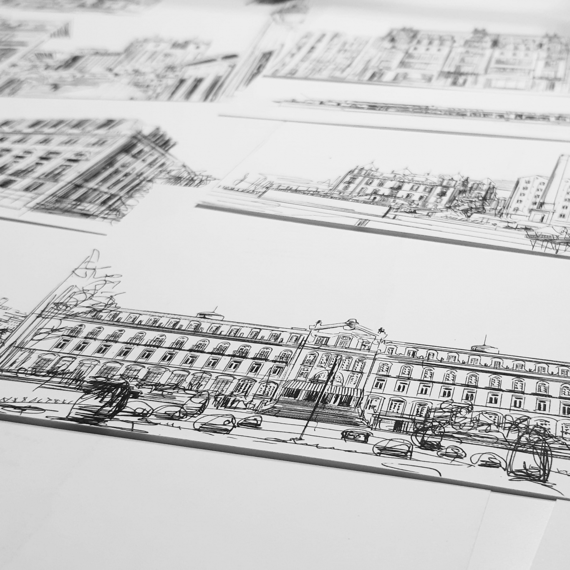 opografia personalizada Desenhos a preto e branco de edifícios em folhas de papel brancas
