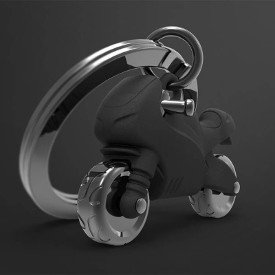 Porta-chaves em forma de motocicleta preta com rodas metálicas prateadas e anel prateado.