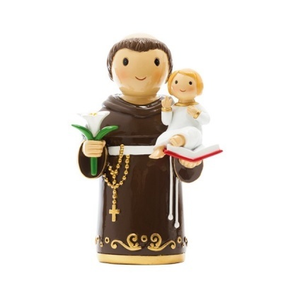 Figurina de santo com menino segurando flor e livro