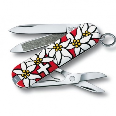 Canivete multifunções Victorinox com cabo decorado e várias ferramentas abertas.