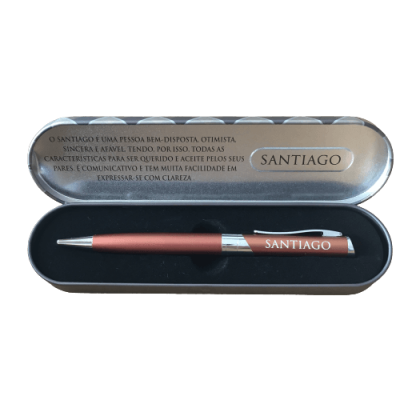 Caneta metálica cobre em estojo metálico prateado com texto em português no interior da tampa