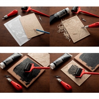 Processo de gravação em linóleo com ferramentas e tinta preta numa mesa de madeira.