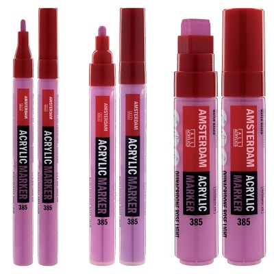 Três marcadores acrílicos cor de rosa/lilás com tampas vermelhas e diferentes pontas.