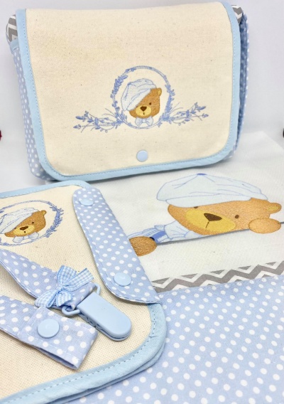 Produtos têxteis para bebé em tecido azul com ursinho e fecho de pressão