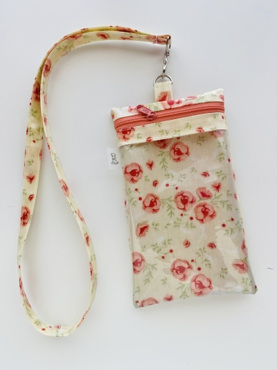 Bolsa transparente com padrão floral e fita para pendurar
