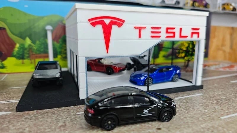 Maqueta da concessionária Tesla com miniaturas de carros em diversas cores