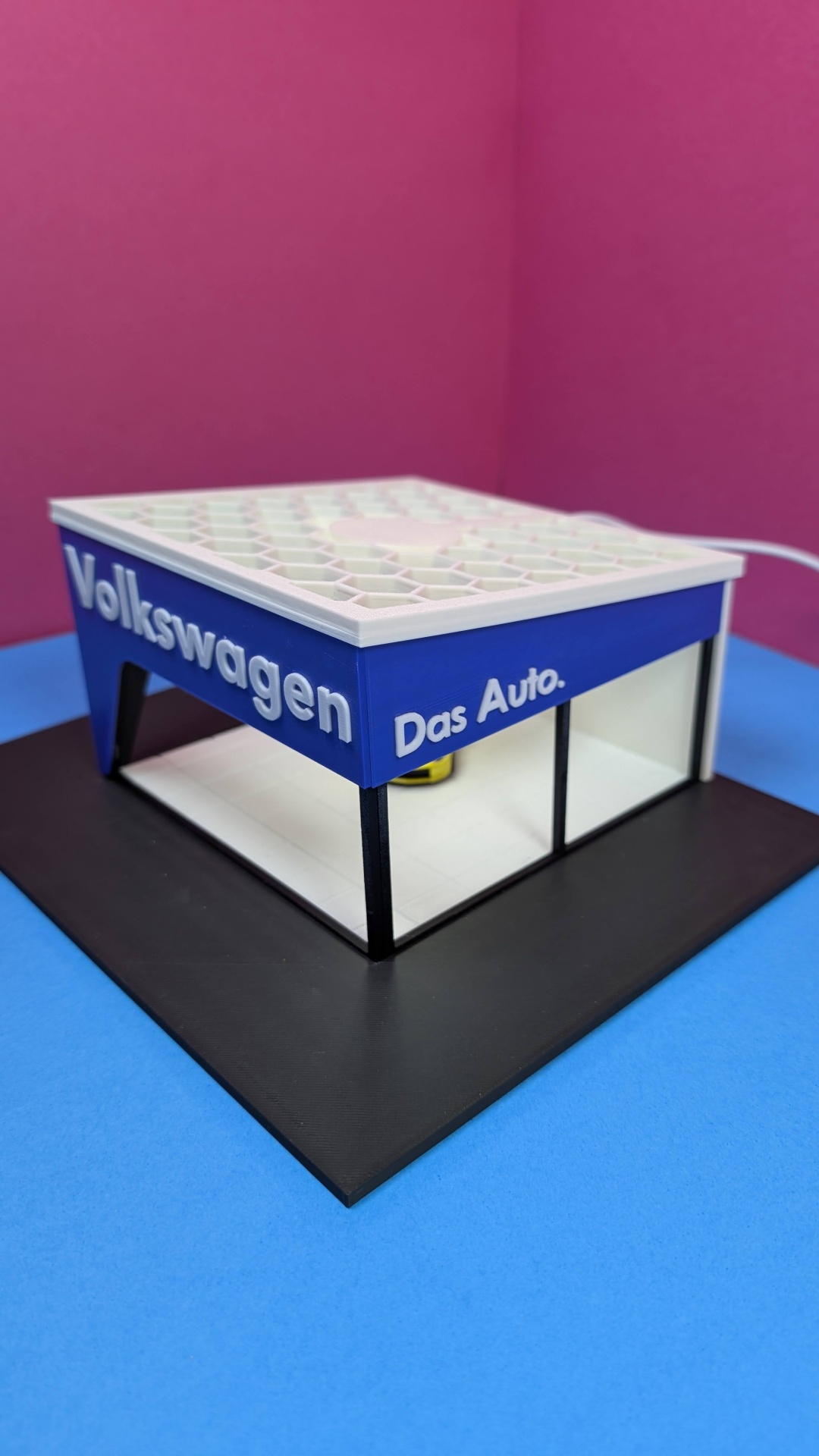 Maquete de loja Volkswagen com texto das Auto.