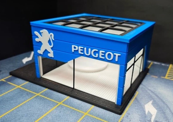 Miniatura do edifício da Peugeot azul com logotipo de leão e texto PEUGEOT