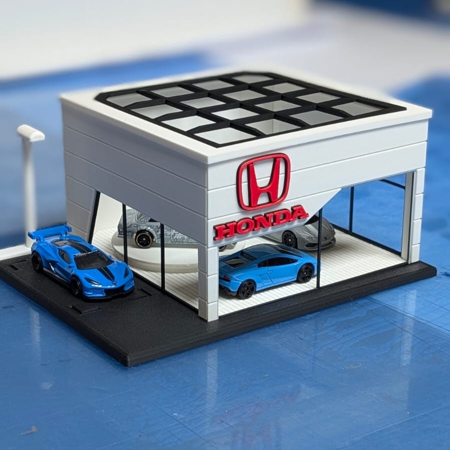Miniatura de concessionária Honda com carros azuis