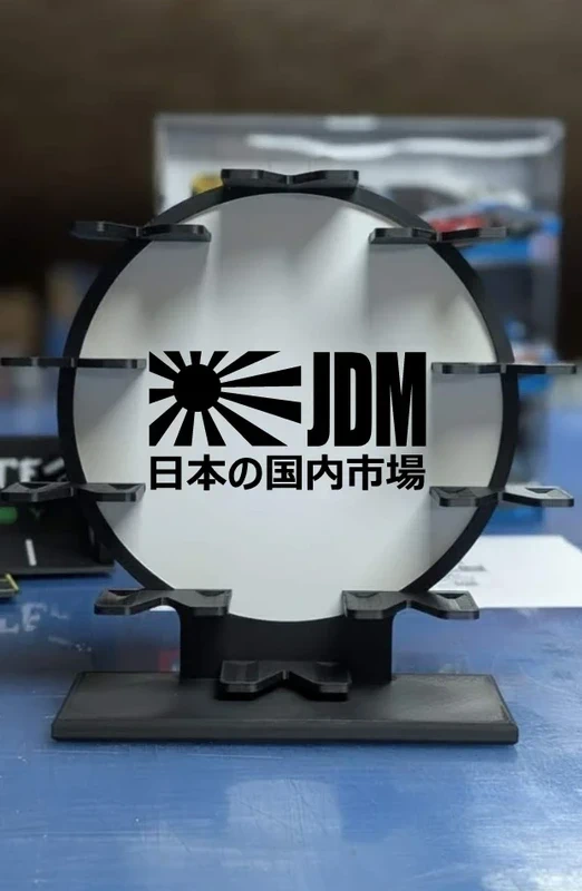 Suporte circular preto com texto JDM e caracteres japoneses