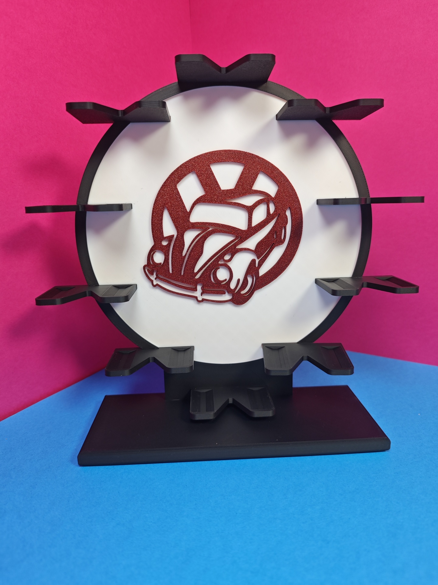 Expositor plástico com suporte e detalhe carro vermelho.