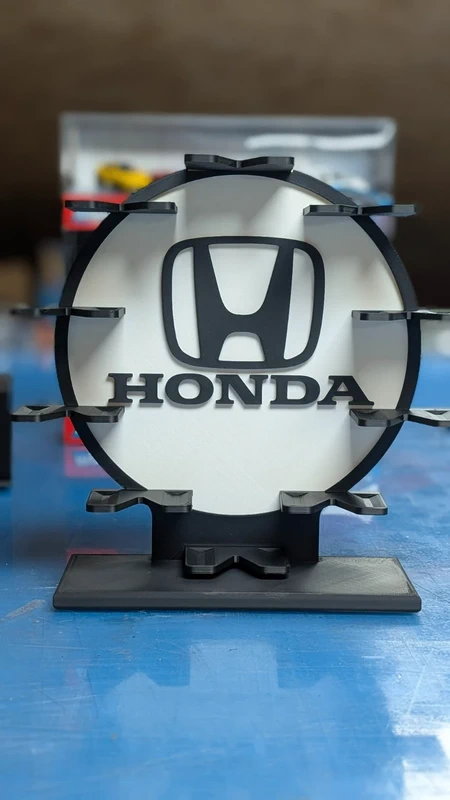 Suporte para capacete com logotipo Honda preto sobre fundo branco