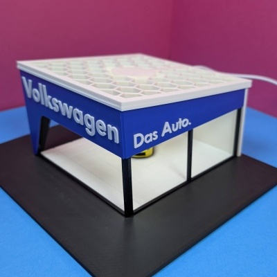 Maquete de loja Volkswagen com texto das Auto.