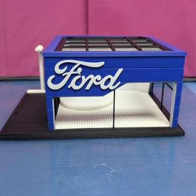Miniatura loja Ford estrutura azul com letras brancas Ford