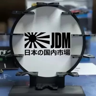 Suporte circular preto com texto JDM e caracteres japoneses