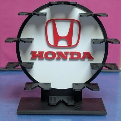 Suporte de exposição redondo com logos Honda e apoios pretos