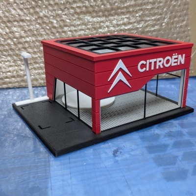 Maquete de loja Citroën vermelha com logótipo branco
