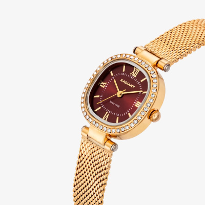 Relógio de pulso dourado com mostrador vermelho e detalhes em cristal