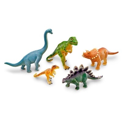 Brinquedos coloridos de dinossauros de plástico em fundo branco