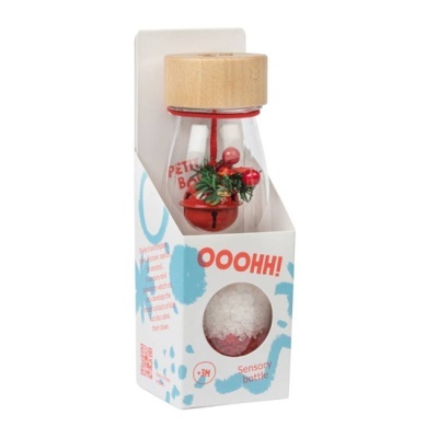 Garrafa sensorial transparente com tampa de madeira clara e decoração interna