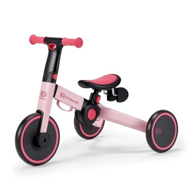 Triciclo infantil rosa e preto com roda dianteira maior e duas rodas traseiras, assento preto com rosa e guiador com punhos rosa