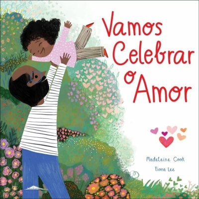 Capa de livro com ilustração de homem a levantar criança e texto Vamos Celebrar o Amor