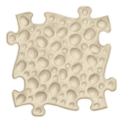 Peça de quebra-cabeças bege com textura em relevo de bolas.